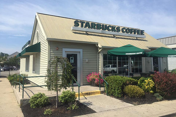 Joe showing Starbucks' windows after cleaning.